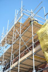 Construction site for new houses. Scaffolding.